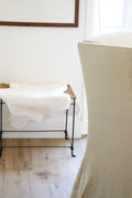 Aged Iron Stool with Sheepskin